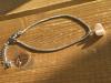Bracelet en acier, pendentif coquillage
